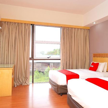 Oyo 89866 Houz Inn Бинтулу Экстерьер фото