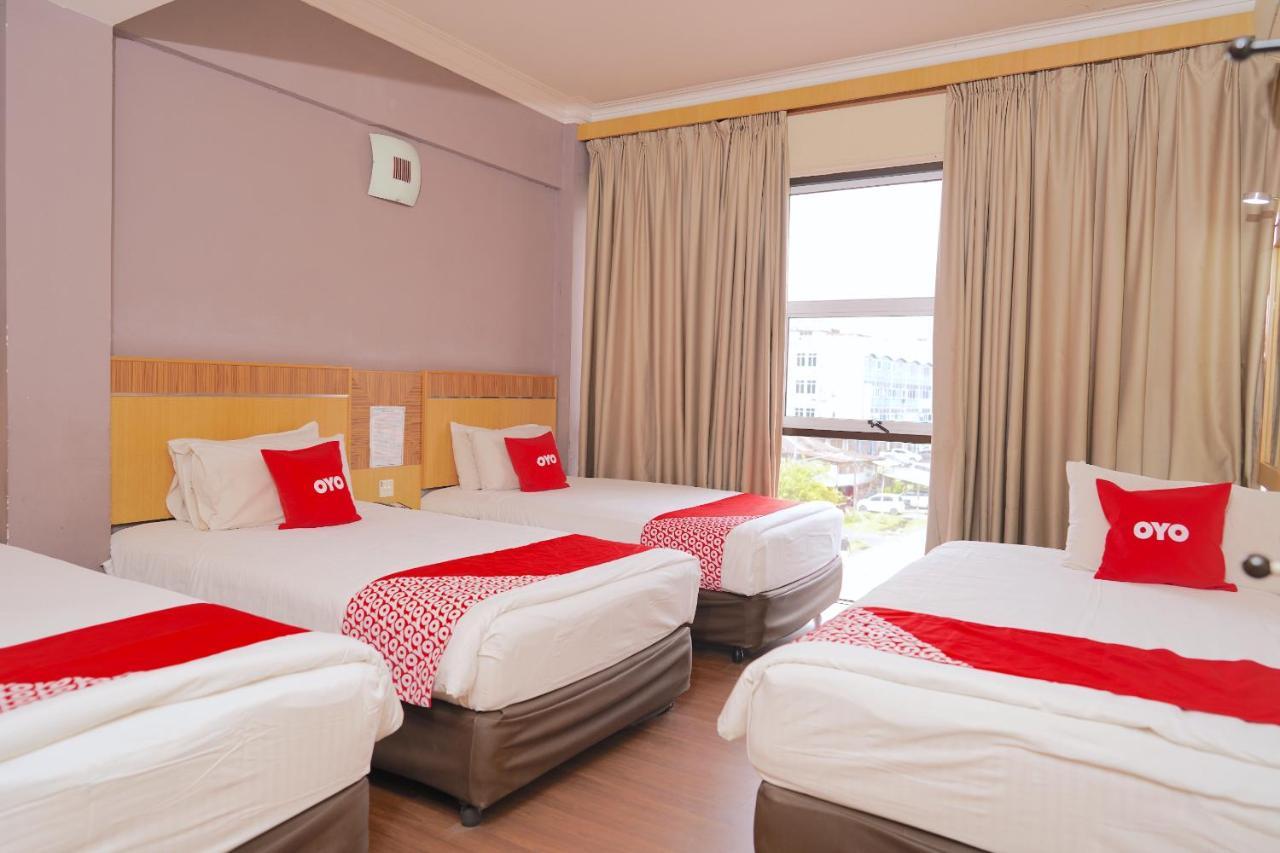 Oyo 89866 Houz Inn Бинтулу Экстерьер фото